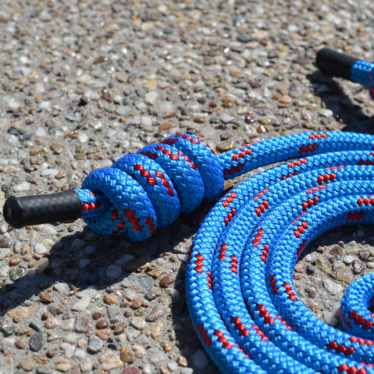 Close-up of Spiral Flow 12mm double-braided flow rope showing soft dense texture ideal for rotational movement practice. Azure Kingfisher