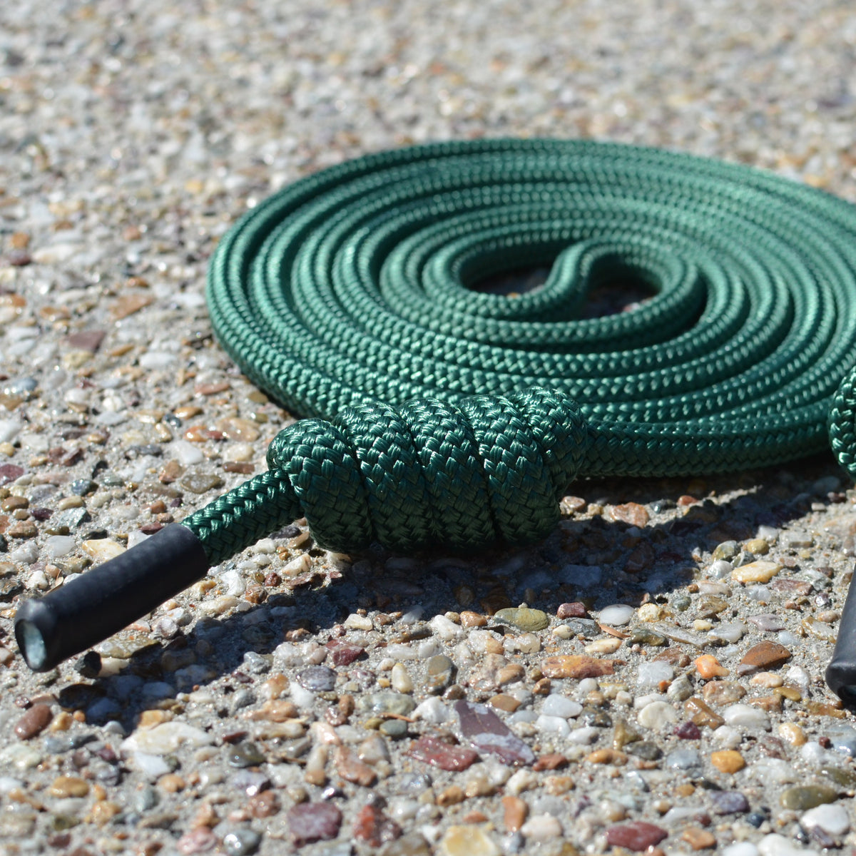 Close-up of green Spiral Flow 10mm double-braided flow rope showing soft dense texture ideal for low-load rotational practice. 