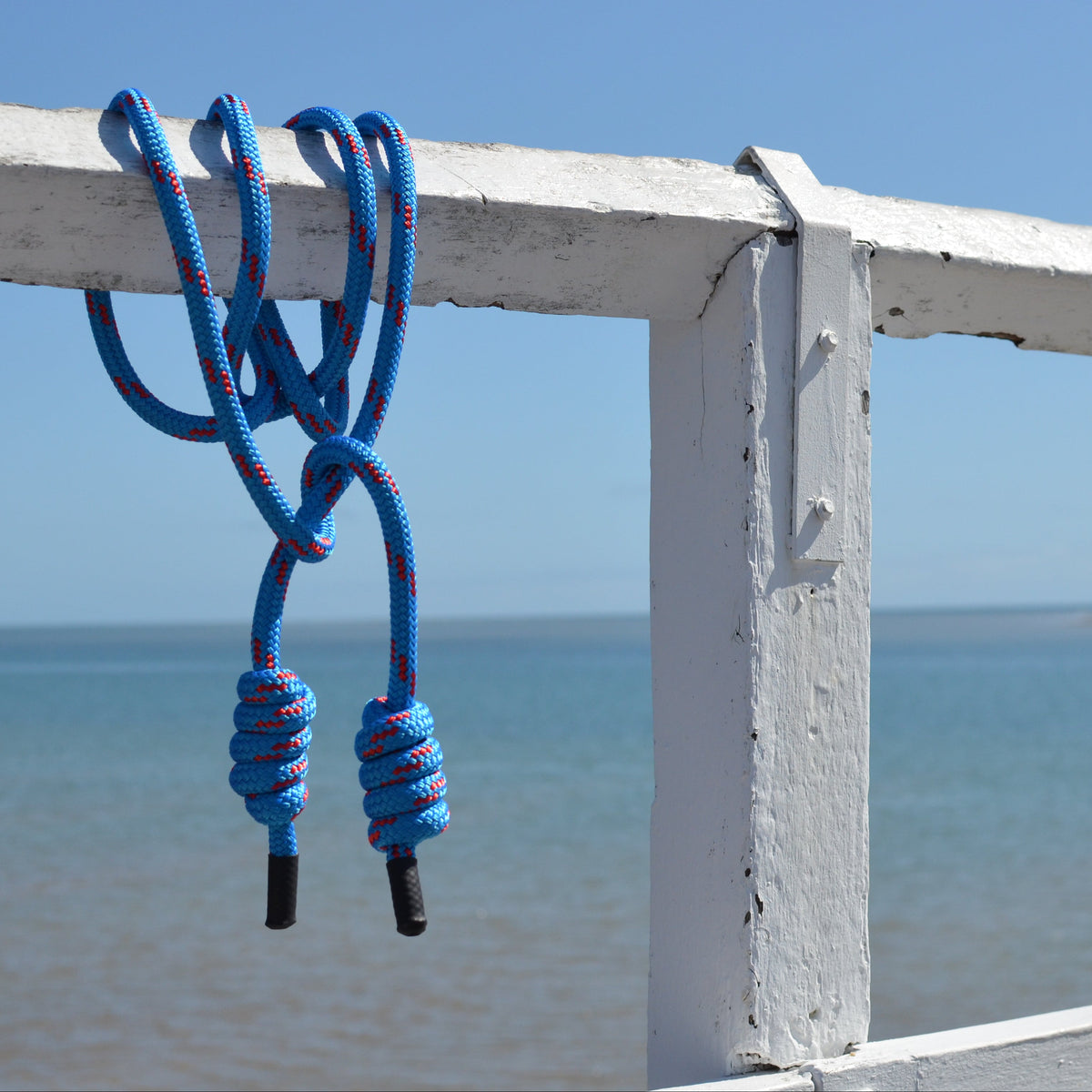 Close-up of Spiral Flow 12mm double-braided flow rope showing soft dense texture ideal for rotational movement practice. Azure Kingfisher.