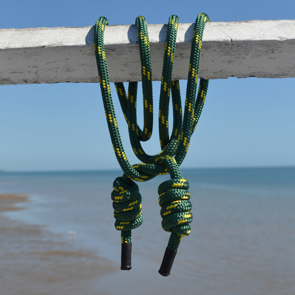 14mm flow rope in vibrant green double-braided polyester for rope flow mobility and coordination training. Pier and Ocean background